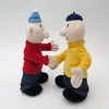 Two plush toys of the characters Pat and Mat are shaking hands. Produktbild-Vorschau