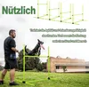 A man is training his dog with agility equipment in a park. Voir les images du produit