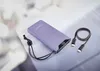 A purple power bank with a digital display showing '90%' and a black USB-C cable are placed on a light gray surface. Voir les images du produit