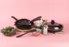 A collection of cookware and decorative items arranged on a pink background. Náhľad obrázku produktu