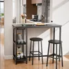 A bar table with two stools set up in a kitchen or dining area, with a kitchen scene in the background. Podgląd zdjęcia produktu