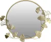 A round wall mirror with a decorative frame featuring ginkgo leaf motifs. Voir les images du produit