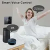 A woman is stretching in bed while a smart thermostat and voice assistants are on a table. Produktbild-Vorschau