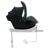 A side view of a black and gray baby car seat with a black canopy, mounted on a white base. A diagram with an arrow and a car seat icon is shown below, indicating a feature or measurement. Produktbild-Vorschau