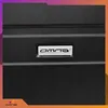 A close-up of a black suitcase with a silver logo. Anteprima dell’immagine prodotto