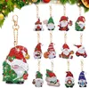 A collection of Christmas-themed diamond painting keychains featuring gnomes and a Christmas tree. Produktbild-Vorschau