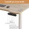 Close-up of a wooden standing desk with control panel and phone charging. Voir les images du produit