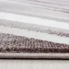 A close-up, side view of a carpet with abstract wavy stripes in shades of gray, white, and brown. Náhľad obrázku produktu