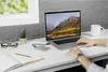 A person's hands are shown using a laptop on a desk, with an external hard drive connected. Anteprima dell’immagine prodotto
