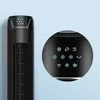 A black tower fan and a black spherical remote control with illuminated icons are shown against a light blue background. Voir les images du produit