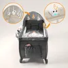 A baby is lying in a crib that is also set up as a playpen. There are toys hanging above the crib and a musical toy attached to the side. Produktbild-Vorschau