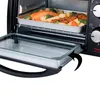 A close-up view of a black mini oven with its glass door pulled out, revealing a baking tray with salmon and vegetables inside. Produktbild-Vorschau