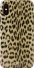 A close-up view of a phone case with a leopard print pattern.