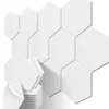 A stack of white hexagonal acoustic foam panels with one panel peeling off to show the adhesive backing. Produktbild-Vorschau