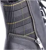 A close-up view of a black leather boot with a plaid fabric insert and a silver zipper. Voir les images du produit