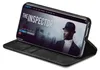 A smartphone in a black flip case is displayed at an angle, showing a movie streaming interface on its screen. Produktbild-Vorschau