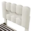 A close-up view of a beige upholstered bed frame with a slatted base visible. Produktbild-Vorschau