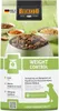 A bag of Belcando dog food with a bowl of kibble in the foreground and ingredients in the background. Produktbild-Vorschau