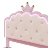 Close-up of a pink upholstered bed headboard with a crown detail and LED lighting. Podgląd zdjęcia produktu