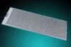 A metal range hood filter with a hexagonal mesh pattern is displayed diagonally against a gradient background. Produktbild-Vorschau