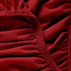 A close-up view of red fabric with elastic gathering. Produktbild-Vorschau