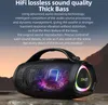 A black portable speaker with colorful lights and a handle, placed on rocks with a mountain landscape in the background. Produktbild-Vorschau