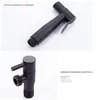 A black handheld bidet sprayer and a black angle valve are shown against a white background. Produktbild-Vorschau