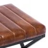 A close-up view of a brown upholstered stool with a metal frame. Náhľad obrázku produktu