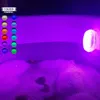 A bathtub filled with bubbles, illuminated by purple LED lights. A separate white LED light is visible on the right side. Anteprima dell’immagine prodotto