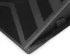 A close-up view of a black ramp with a geometric pattern. Voir les images du produit