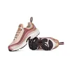 A pair of Reebok Daytona Dmx sneakers are shown against a white background. One shoe is standing upright, while the other is lying on its side, revealing the sole. Anteprima dell’immagine prodotto