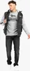 A man wearing a puffer vest, sweatshirt, and jeans. Anteprima dell’immagine prodotto
