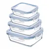 A stack of four square glass food storage containers with blue lids. Podgląd zdjęcia produktu