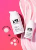Two bottles of K18 Leave-In Molecular Repair Hair Mask are shown on a pink background with a swirl of pink cream. There is text and graphics illustrating the product's usage. Náhľad obrázku produktu