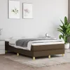 A bedroom scene with a bed, two framed pictures on the wall, and a plant. Podgląd zdjęcia produktu
