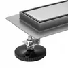 A close-up view of a shower drain with an adjustable foot. Anteprima dell’immagine prodotto