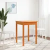A wooden table and two chairs are set up in a room with a plant and a painting on the wall. Anteprima dell’immagine prodotto