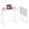 A white folding desk is shown in two configurations: one set up with a laptop and decorative items, and the other folded and standing upright. Produktbild-Vorschau