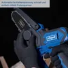 A close-up shot of a person's hands wearing black gloves, holding and adjusting a cordless chainsaw. Voir les images du produit