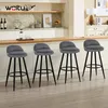 Four dark gray bar stools are arranged in a row in front of a kitchen counter. Produktbild-Vorschau