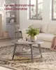 A living room scene with a coffee table as the central focus, decorated with a vase of greenery and books. Produktbild-Vorschau