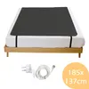 A bed frame with a dark gray mat and bedding, shown with an electrical cord and plug, and a circular graphic with dimensions. Produktbild-Vorschau