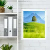 A framed picture of a landscape is displayed on a white brick wall, next to a shelf with binders and plants. Anteprima dell’immagine prodotto