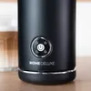 Close-up of a black milk frother with a control panel and a glass of frothed milk in the background. Produktbild-Vorschau