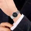 A person wearing a watch on their wrist. Produktbild-Vorschau