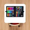 An open art supply case on a wooden surface. Podgląd zdjęcia produktu