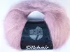 A ball of pink yarn with a black label. Produktbild-Vorschau
