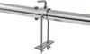 A close-up view of a stainless steel automatic grill skewer with a motor attachment, mounted on a metal rod. Náhľad obrázku produktu
