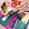 A person is opening a Sephora advent calendar, revealing a blush product. Produktbild-Vorschau