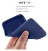 A hand is holding a flexible blue phone case, demonstrating its softness and flexibility. Náhled obrázku produktu
